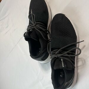 Under Armour Black and White Athletic Shoes with Streamlined Design